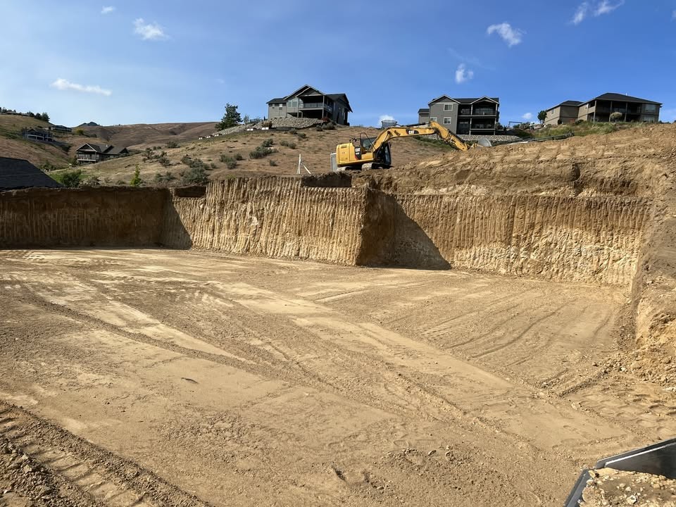 Potter Built excavator digging a building pad